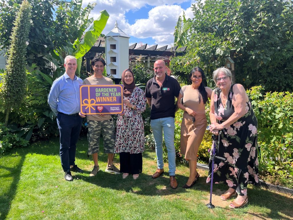 Council leader Dominic Twomey (left) and cabinet member for housing Maureen Worby (right) with winners Abul and Nour, sponsor David from Chandlers Roofing Supplies, and housing officer Emma