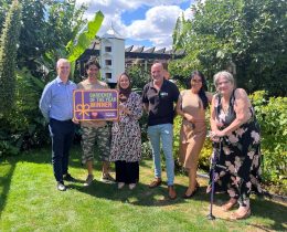 Council leader Dominic Twomey (left) and cabinet member for housing Maureen Worby (right) with winners Abul and Nour, sponsor David from Chandlers Roofing Supplies, and housing officer Emma